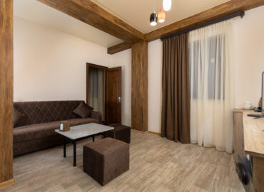 sitting area in deluxe room - Alaska Resort